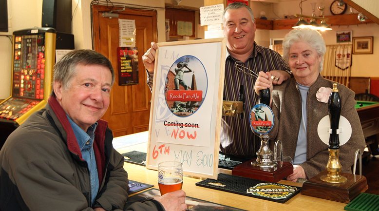 Kim Cessford, Courier - 06.05.10 - Pan Ale is now on tap at The Roods Bar in Kirriemuir - pictured enjoying the first pint of the new ale is left Roger Slaney who had travelled 500 miles from Woodcote, Near Reading, publican Jim Glenvinning and Elizabeth Hill - words from Ren in Forfar
