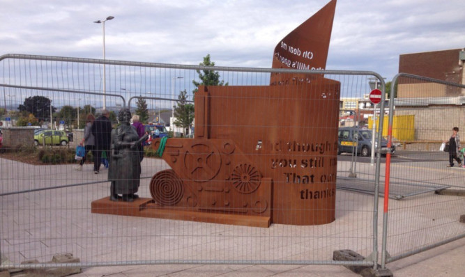 Security fencing around the sculpture on Tuesday.