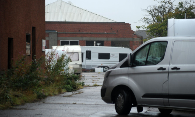 Travellers had been illegally parked at the former Keiller factory site on Mains Loan for more than a week.