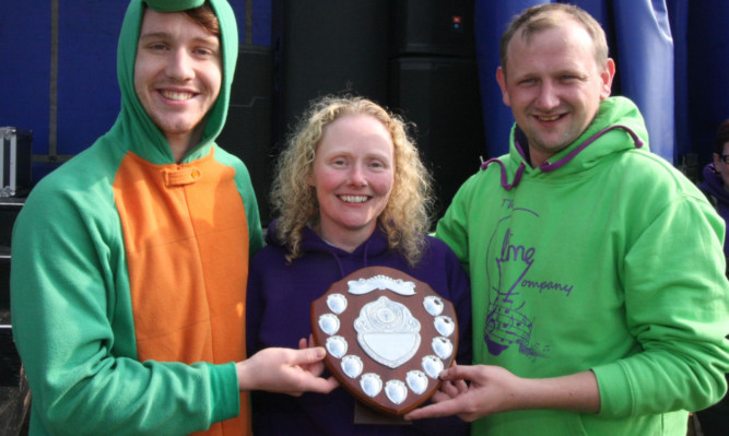 The award for the highest fundraising team went to the Limelight Theatre Group. Chris OMara, left, and Michael Carlin receive their trophy from Gail Bogue.