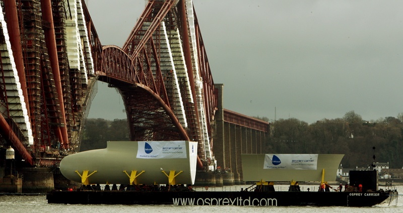 North Queensferry.    Passing under the Forth Bridge.  Pic shows the barge carrying the bow sections from the new aircraft carrier which will be assembled at Rosyth.