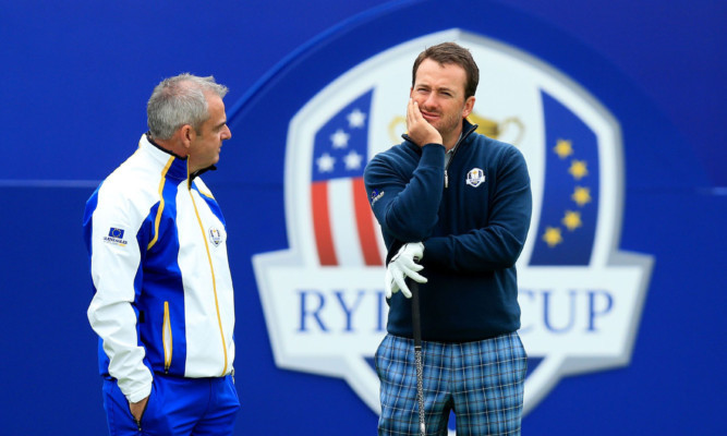 Paul McGinley (left) and Graeme McDowell have recognised a 'changed dynamic' with Rory McIlroy.