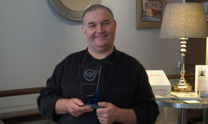 Andrew Stott, from Arbroath, with his award for Best European Restaurant.