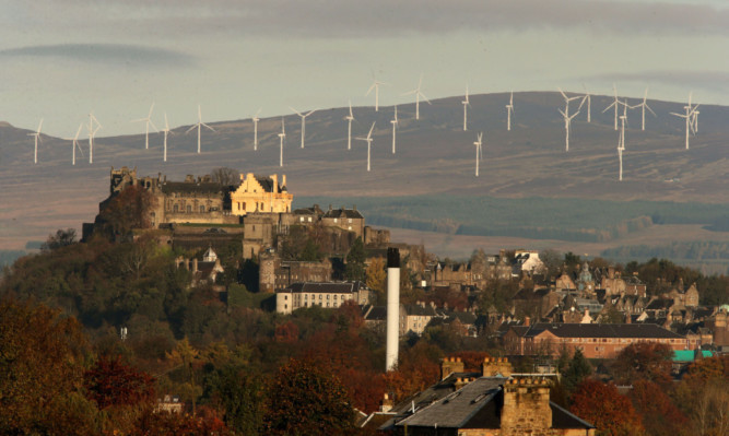 Stirling Castle with the Braes of Doune windfarm behind it.