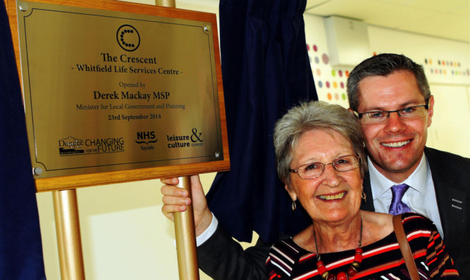 Local government minister Derek Mackay MSP with Pat Stewart, chairwoman of the centres management committee, at the official opening of the Crescent, Whitfield.