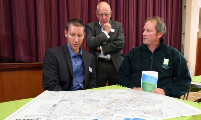 Reviewing the plans: Matthew Hayes, head of planning and project management, Stephen Salt, planning and public affairs director, and Victor Clements, community council chairman.