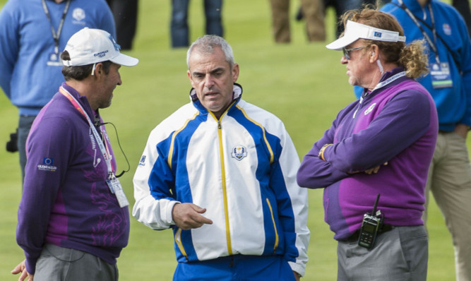 Captain McGinley talks tactics with vice-captains Miguel Angel Jimenez, right, and Jose Maria Olazabal.