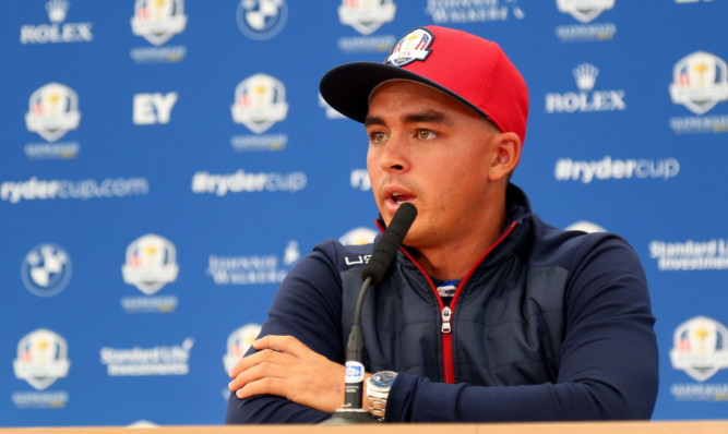 Rickie Fowler faces the press.