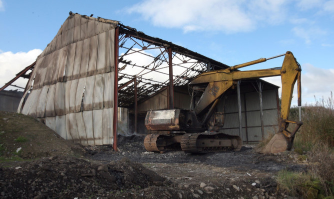 The fire at Pittendynie Farm ripped through a barn and caused extensive damage to a digger.