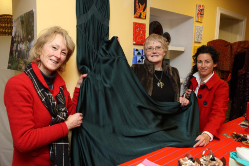 Pictured holding a dress designed by Amanda Whatley which is hoped to sell for £140 are (from left) Judy Thomson, Gilly Tambanhabay and Alanna Fraser at the opening of the charity shop in Perth's High Street.