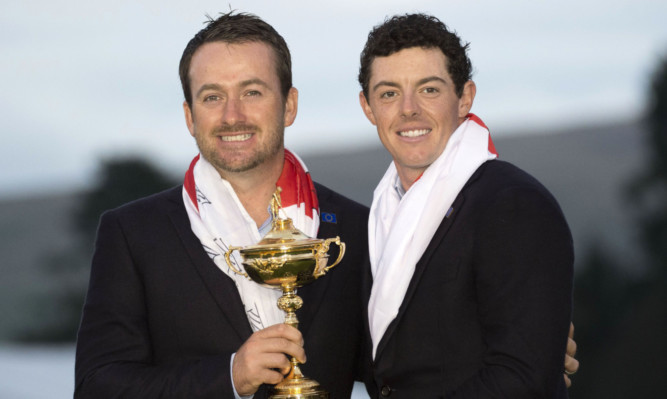Graeme McDowell (left) and Rory McIlroy celebrate with the Ryder Cup.