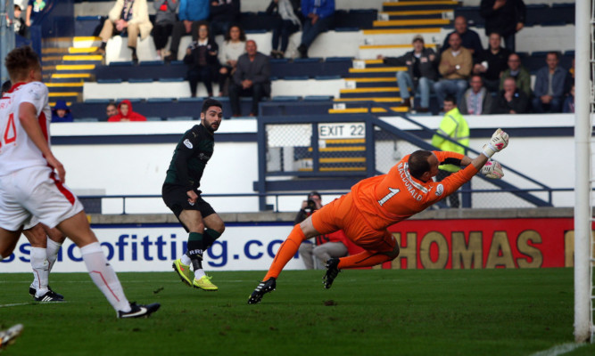 Jamie MacDonald punching Rory McKeowns shot around the post.