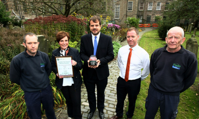At the Howff with the Wright Sustainability Award (from left) Mark McKay, Greenspace team leader Alison Anderson, Councillor Craig Melville, Jay Grant of Dundee City Council and Tony Gibb.