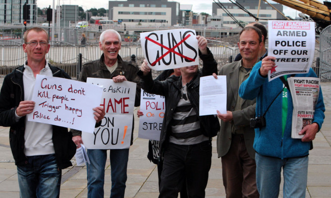Anti-gun protesters demonstrated against the policy when the justice secretary visited Dundee in August.