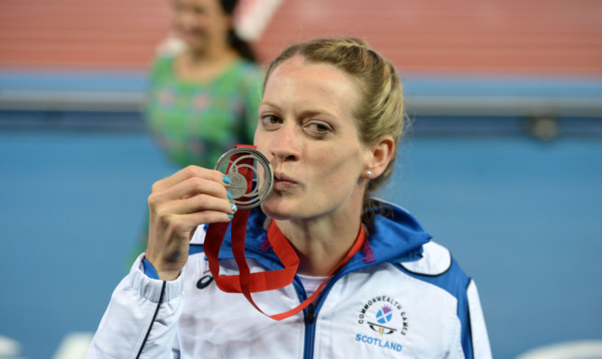 Eilidh Child kisses her Commonwealth Games silver medal  a highlight of a hugely successful year.