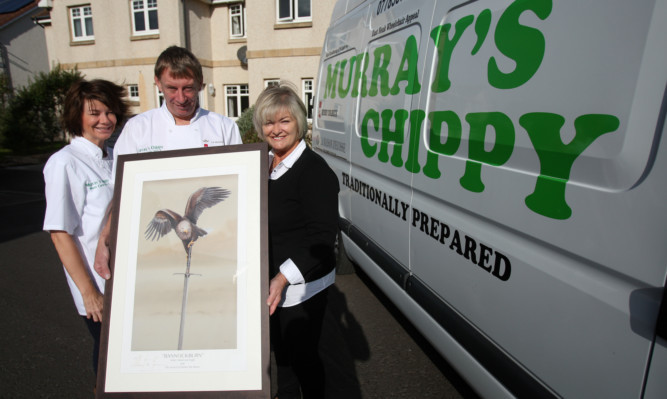 Murray and Irene Cameron present Eleanor Bowman with the print.