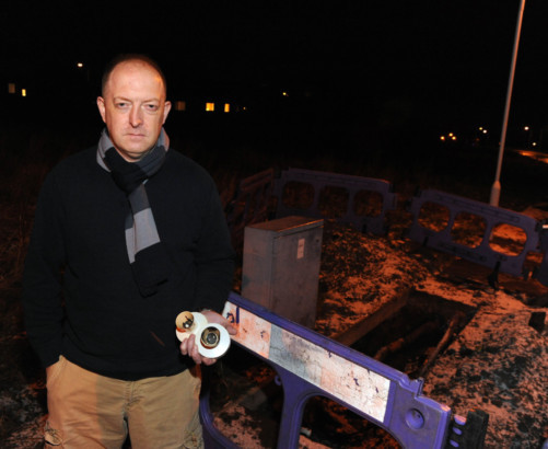 James Ross with some of the fire damaged light fittings from his house.