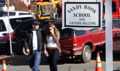 Parents walk away from the school in tears.