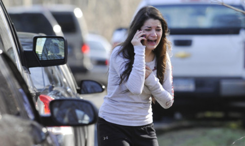 A woman waits to hear about her sister, a teacher.