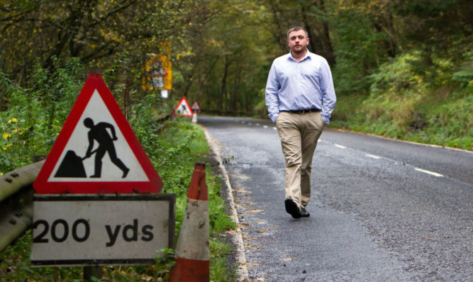 Bridge of Cally Hotel owner Donald Allan on the A93 at the south approach to his hotel. He says the roadworks near his business are costing him £1,000 a day.
