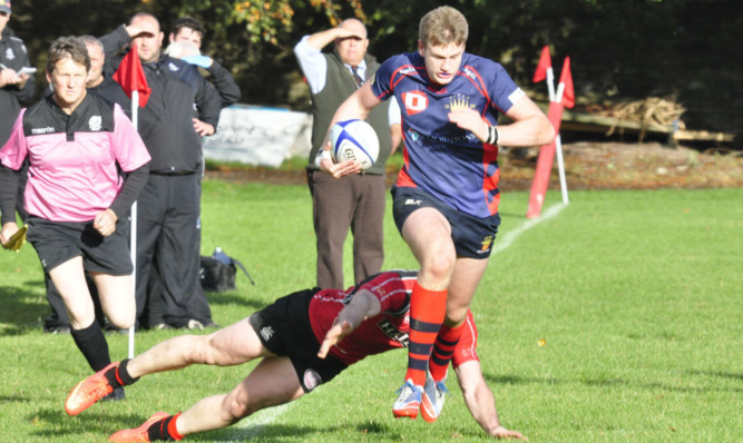 Blair Cochrane bolts down the wing in Dundees victory over Biggar.