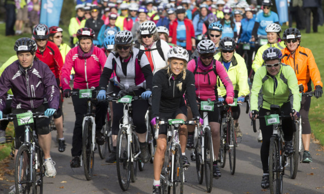 Macmillan Cycletta, Scone Palace, Perth....05.10.14
Over 700 female cyclists took part in this morning's Macmillan Cycletta on a variety of courses ranging from 20km up to 100km around the Perthshire countryside. Pictured Cat Cubie setting off on the 40km race.
for further info please contact Tricia Fox on 07989 955039
Picture by Graeme Hart.
Copyright Perthshire Picture Agency
Tel: 01738 623350  Mobile: 07990 594431