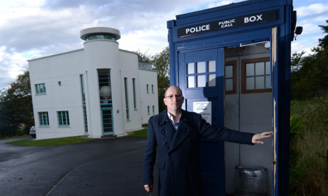 Tony Allen from Fordoun at home beside his Tardis. Dr Who fanatic Tony Allens designer house has gone on the market complete with the life-sized Tardis.