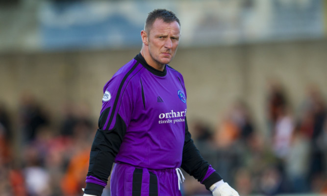 Rab Douglas in action for Forfar.