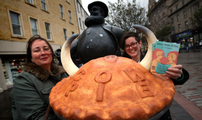 Anna Day and Peggy Hughes serve Desperate Dan up a cow pie.