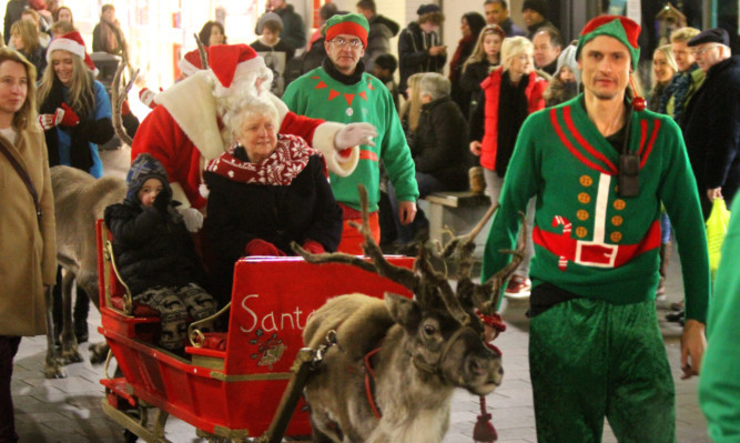 Santa and Provost Liz Grant during the parade during last year's parade.