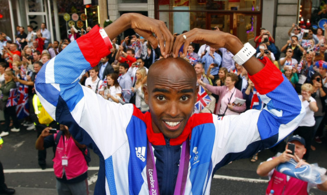 Mo Farah does the 'Mobot' during an end-of-Olympics parade in London in the summer.