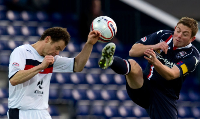 Matt Lockwood getting stuck in against Ross County at the weekend.