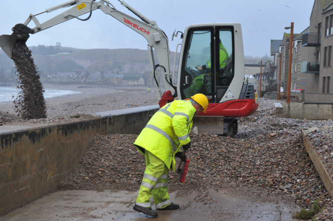Council workers clear up some of the debris in Stonehaven.