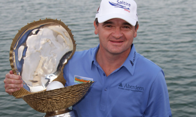 Paul Lawrie with his trophy after his win in Doha this year.