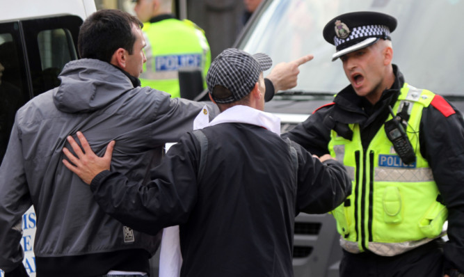 Scottish Defence League protesters confronting police during a rally in Dundee last October.