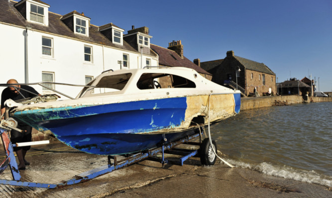 A badly damaged boat after it was recovered from Stonehaven Harbour.