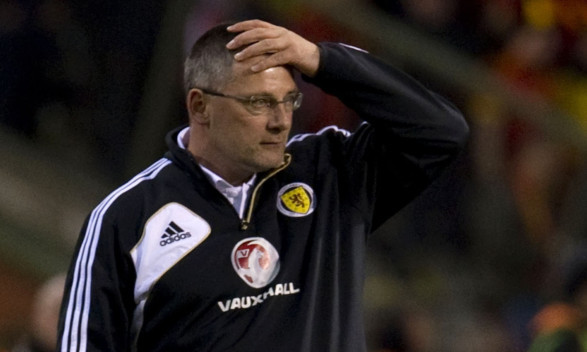 Craig Levein watches his side lose to Belgium, in what proved to be his last game as manager.