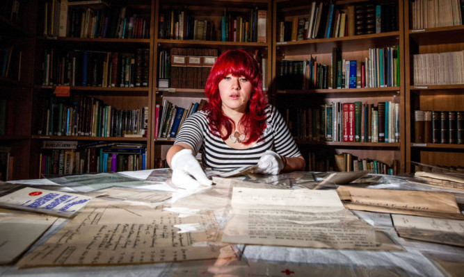 Suzanne Paterson, Great War Dundee project officer, with some of the items from the time capsule that have gone on display in the city.