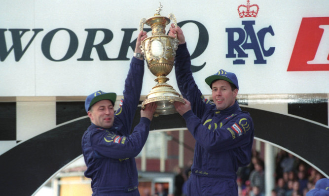 Colin McRae, right, celebrates his world championship win in 1995.