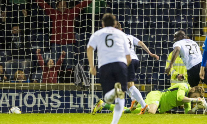 Raith Rovers Christian Nade, wearing number 27,  celebrates with team-mates after scoring his sides second goal of the match.