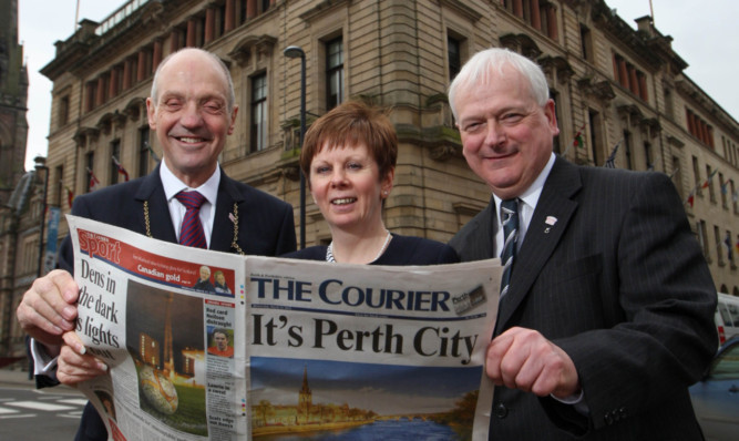 Provost Dr John Hulbert, council chief executive Bernadette Malone and leader Councillor Ian Miller celebrating confirmation of city status in March.