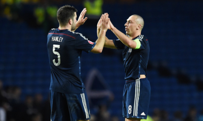 Scotland's Scott Brown (right) celebrates with Grant Hanley at full-time.