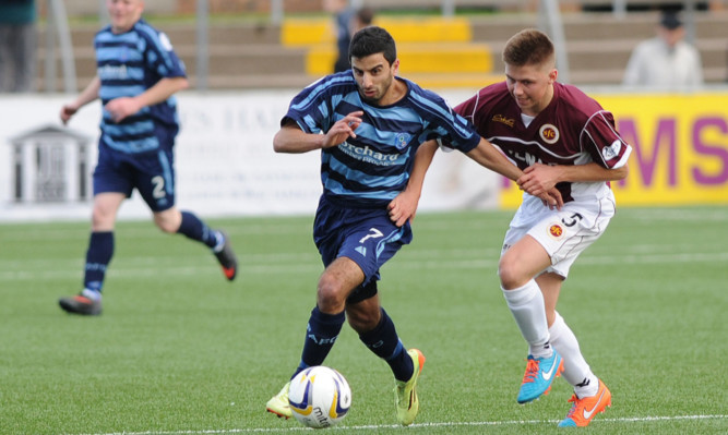 Forfar's Omar Kader (left) tussles with Ciaran Summers.