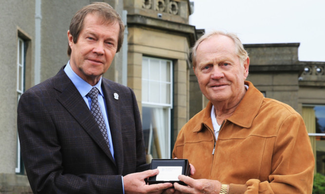 Jack Nicklaus receives Honorary Membership of the European Tour from chief executive George O'Grady at Gleneagles.