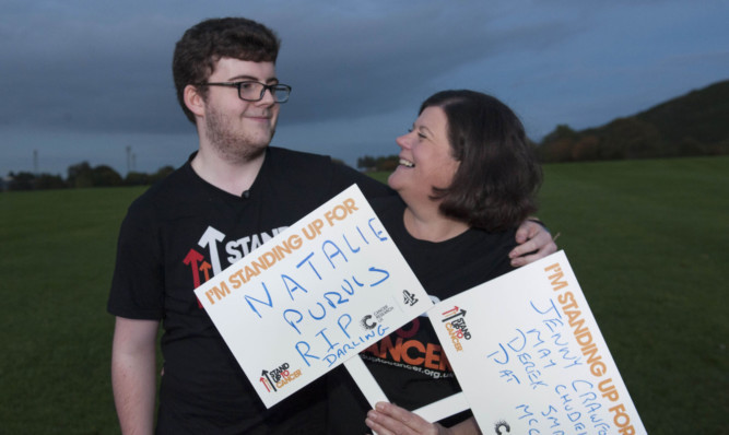 Matthew and his mum, right, took part in the march to remember Natalie.