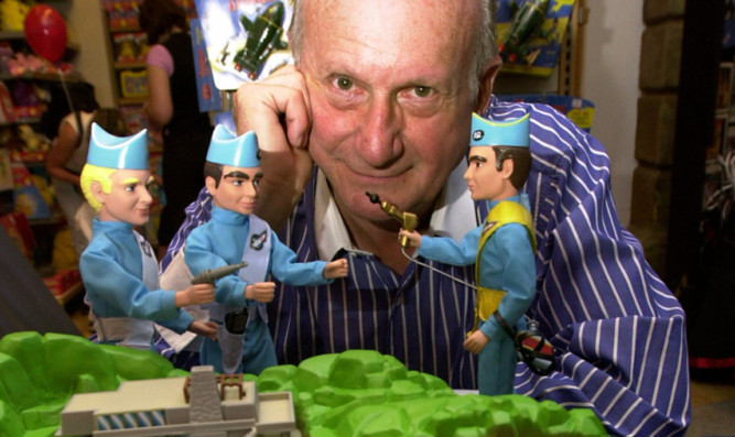 Gerry Anderson, with some of his famous characters.