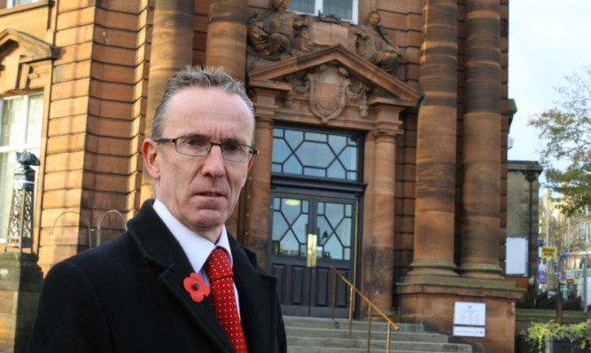 Councillor Fraser Macpherson outside Blackness Library.