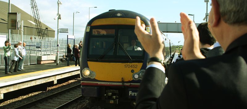 The first train to pull in at Laurencekirk station for over 42 years.  "The train stopping at platform 1, is the first one to do so for 40 years!". The train pulls in to warm applause from the gathered crowds at Laurencekirk Station.