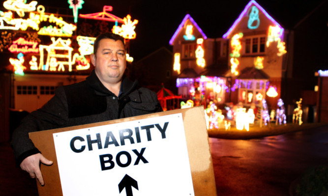 Gary Ormiston has been left with the sign for his familys charity collection.