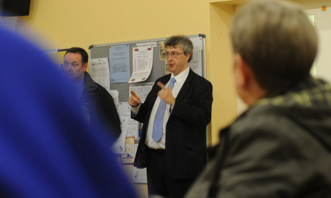 Phil Smith, managing director of National Express Dundee, answers questions from the public at the meeting in the Midlin Centre, Pitkerro Drive.